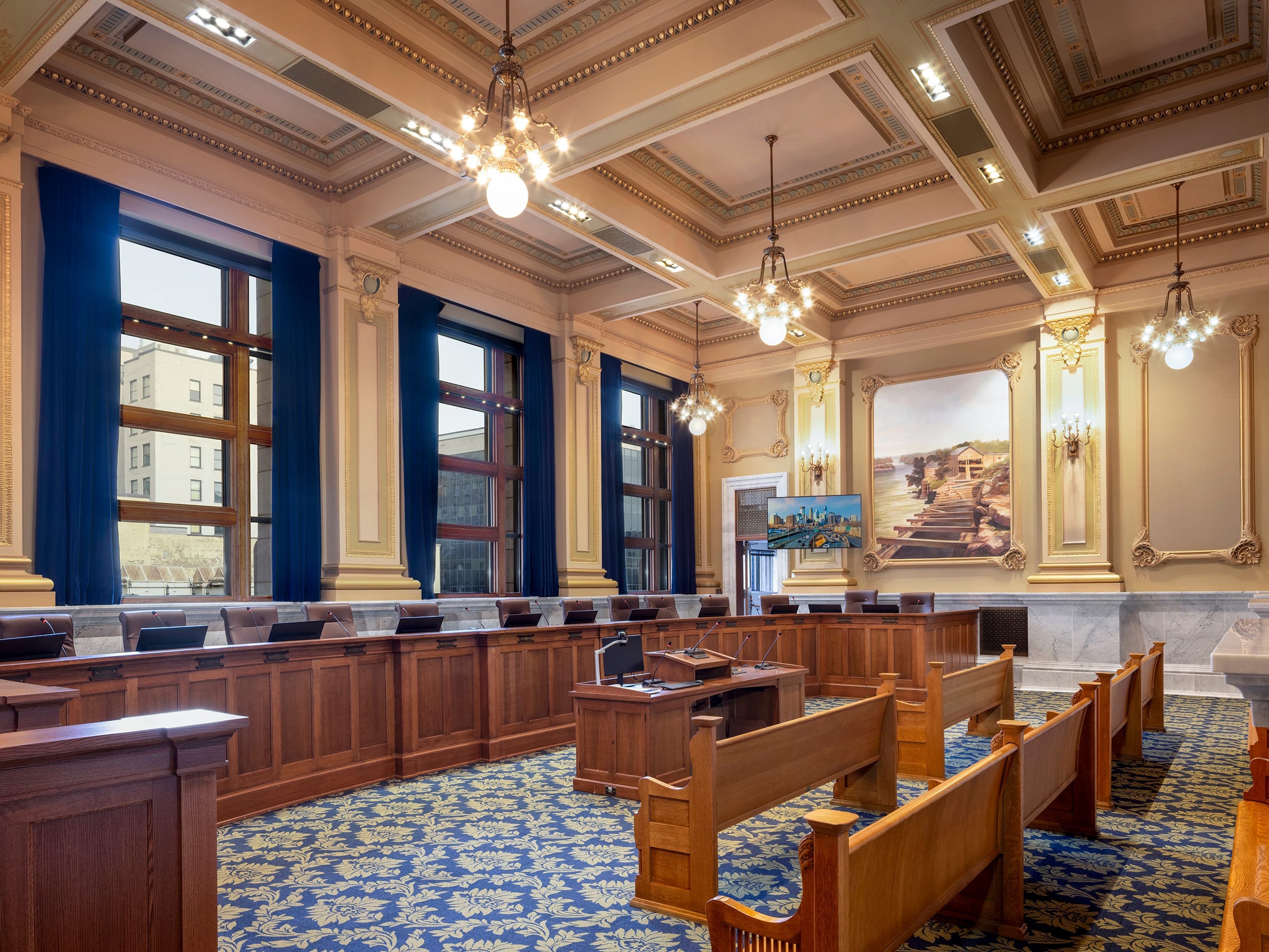 Minneapolis civic chamber with delegate microphones and integrated displays