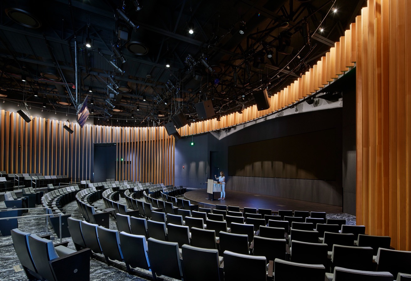 Microsoft Silicon Valley event theater with a large presentation wall, stage, lighting, and production systems